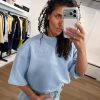 Lichtblauwe Maxi split logo sweat van Haute L'Amitié met oversized pasvorm en logo detail, casual dames sweater met moderne uitstraling