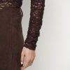 Dante6-Irony-Lace-Turtle-Neck-Top-donkerbruin-263275_8880_D6_875 Dante6 Irony Lace Turtle Neck Top in donkerbruin, transparante kanten dames top met hoge col en vrouwelijke pasvorm.