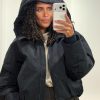 Co’Couture RilloCC Puffer Jacket 500154 in Black, zwarte gewatteerde dames puffer met hoge kraag, capuchon en ritssluiting.