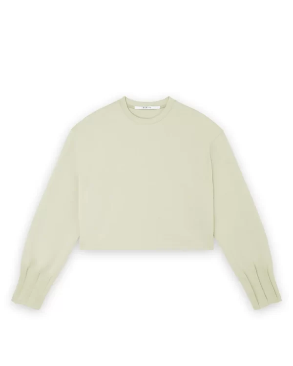 HOMAGE Top With Cuff Details in Pistachio, pistachegroene dames top met verfijnde manchetdetails en vrouwelijke uitstraling.